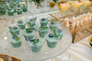 Wedding. Candy bar. Candy bar at banquet. Wedding table with sweets, cake, pastries, muffins, sugar treats. Event in restaurant