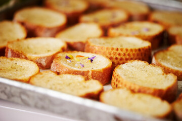 Oven-baked baguettes, sliced baguettes on a plate 