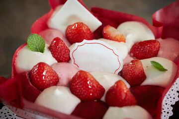Strawberry cake with whipped cream on the table