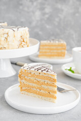 Traditional Esterhazy cake with almonds and pralines on a gray concrete background. Selective focus. Copy space.