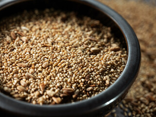 sesame seeds on a black plate