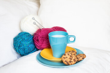 Breakfast in bed with chocolate cookies and milk