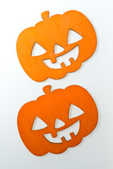 halloween themed laser cut plywood shapes arranged on an illuminated white background (with strobe...