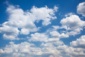 Naklejka na ściany i meble Beautiful fluffy clouds in the sky