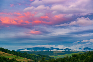 Fototapeta premium Pink sunset sky in the mountains.