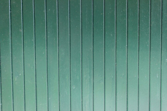 Close up of green wooden shed