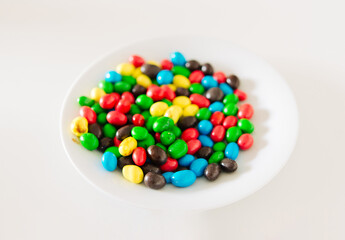 colorful candies in a plate on the table