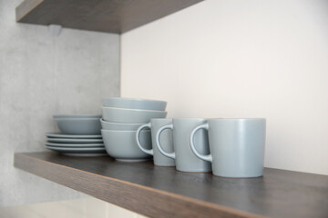 Fototapeta na wymiar gray cups and plates in the kitchen
