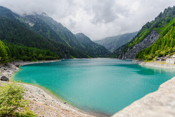 Panoramic view of the turquoise water of Lago dei Cavalli (Lake of Horses) in Antrona Valley, Piedmont Italy