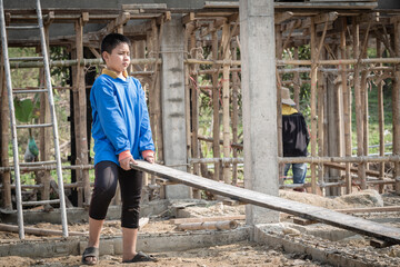 Against child labor. Children working hard at construction sites. Child labor.