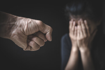 A man's hand will hurt a woman. Domestic violence and harassment of women. International Women's...