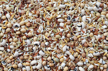 Mixed dry organic cereal and grain seeds pile on white background, for healthy or clean food ingredient or agricultural product concept