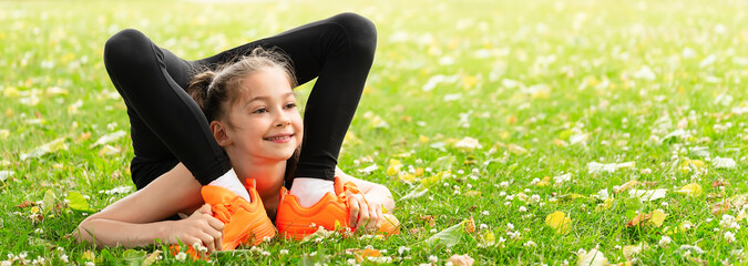 Girl gymnast in the park goes in for sports. Photo series. Banner