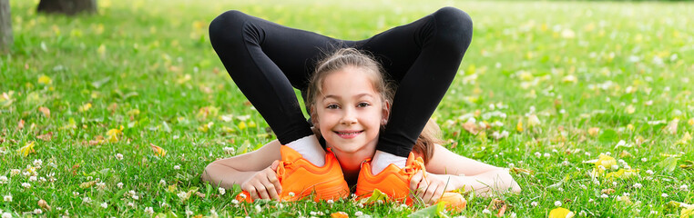 Girl gymnast in the park goes in for sports. Photo series. Banner