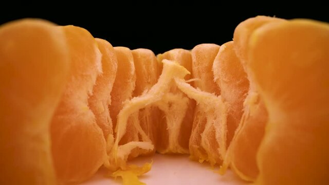 camera removes from set of tasty peeled mandarin wedges