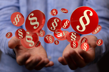 Hand hält Paragraphen Symbol