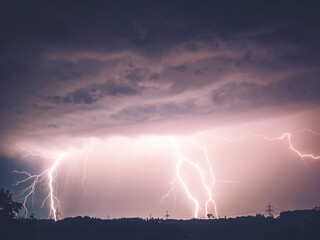 Obraz na płótnie Canvas Thunderstorm with Lightning and Power Cables