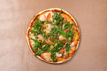 pizza with shrimps, dandelion leaves and tomatoes