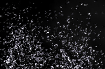 air bubbles in the water isolated on black background