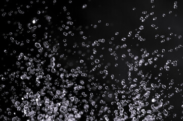air bubbles in the water isolated on black background