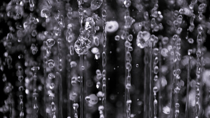 air bubbles in the water isolated on black background
