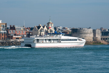 Portsmouth, England, UK. 2021. A passenger catamaran ferry outbound from Portsmouth Harbour ...
