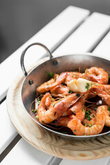 sauteed stir fry large prawns spanish tapas in metal pot