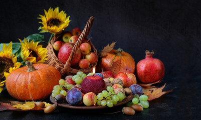 Wiccan altar for Mabon sabbat. Candle, seasonal fruits, pumpkins, flowers, nuts on black background. pagan, Wiccan traditions. Witchcraft, esoteric spiritual ritual.  - obrazy, fototapety, plakaty