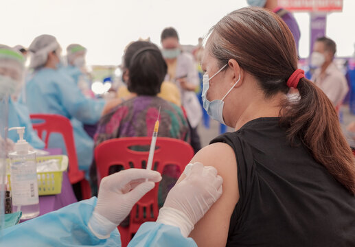 Fat Asia senior woman has gone to vaccinate coronavirus covid19 with medical staff in a field hospitel. a place set up by the government