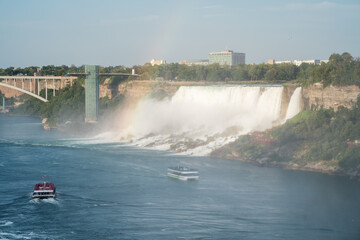Boat in front of Niagara Falls with the rainbow in Ontario Canada