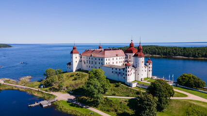Läckö castle in Sweden with a clear blue sky from the side - Drone Perspective Architecture...
