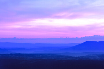 Fototapeta na wymiar landscape of mountain ridges with twilight sky and cloud at Phu Kra Dung National park of Thailand