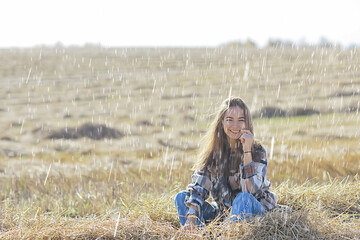 Naklejka na ściany i meble happy young female girl portrait in summer rain country style