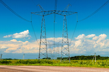 High-voltage towers and cables in fields