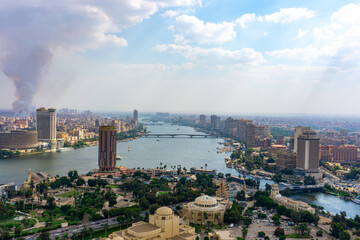 Fototapeta premium View of Cairo and the Nile with smoke in the background