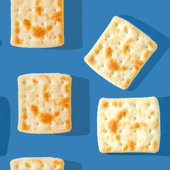 Photo in the form of a seamless pattern. Yellow-brown biscuits with shadows on a colored blue background. High quality photo