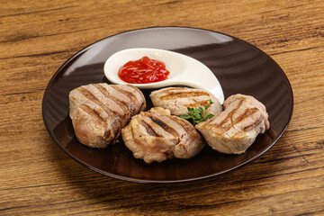 Grilled pork tenderlion with tomato sauce