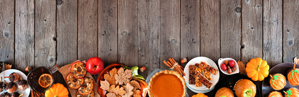 Poster autumn desserts bottom border. table scene with assorted sweet fall treats. top view over a rustic w