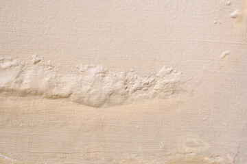 Brown wall damp damaged with peeling paint