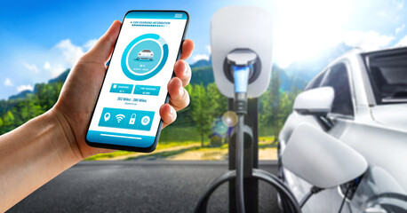EV charging station for electric car with mobile app display charger status . The electric power is...
