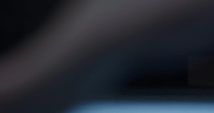 Slow motion man put his feet on floor in midnight and walk