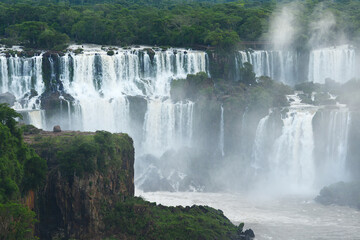 Iguassu waterfall in south america tropical jungle with a massive flow of water
