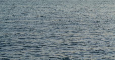 Sea wave water pattern at sunset