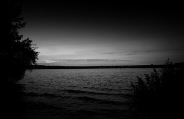 Fototapeta na wymiar Black and white evening river background