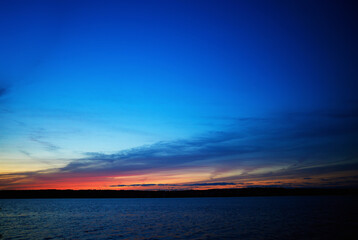 Fototapeta na wymiar Burning sunset on river landscape background