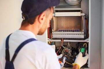 The master engineer maintains the gas heater. Adjusts the combustion of gas in the equipment