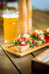 bruschetta with fresh ingredients and beer