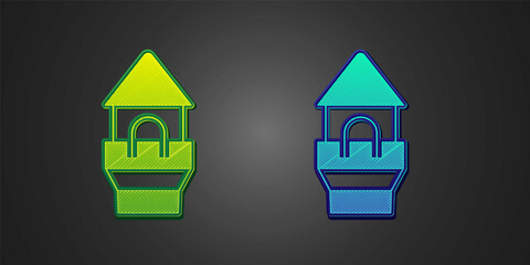 Green and blue Castle tower icon isolated on black background. Fortress sign. Vector