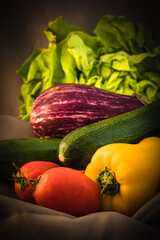 still life with yellow pepper, tomatoes, zucchini, eggplant and salad