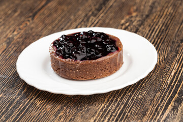 cake with butter cream and black currant jam
